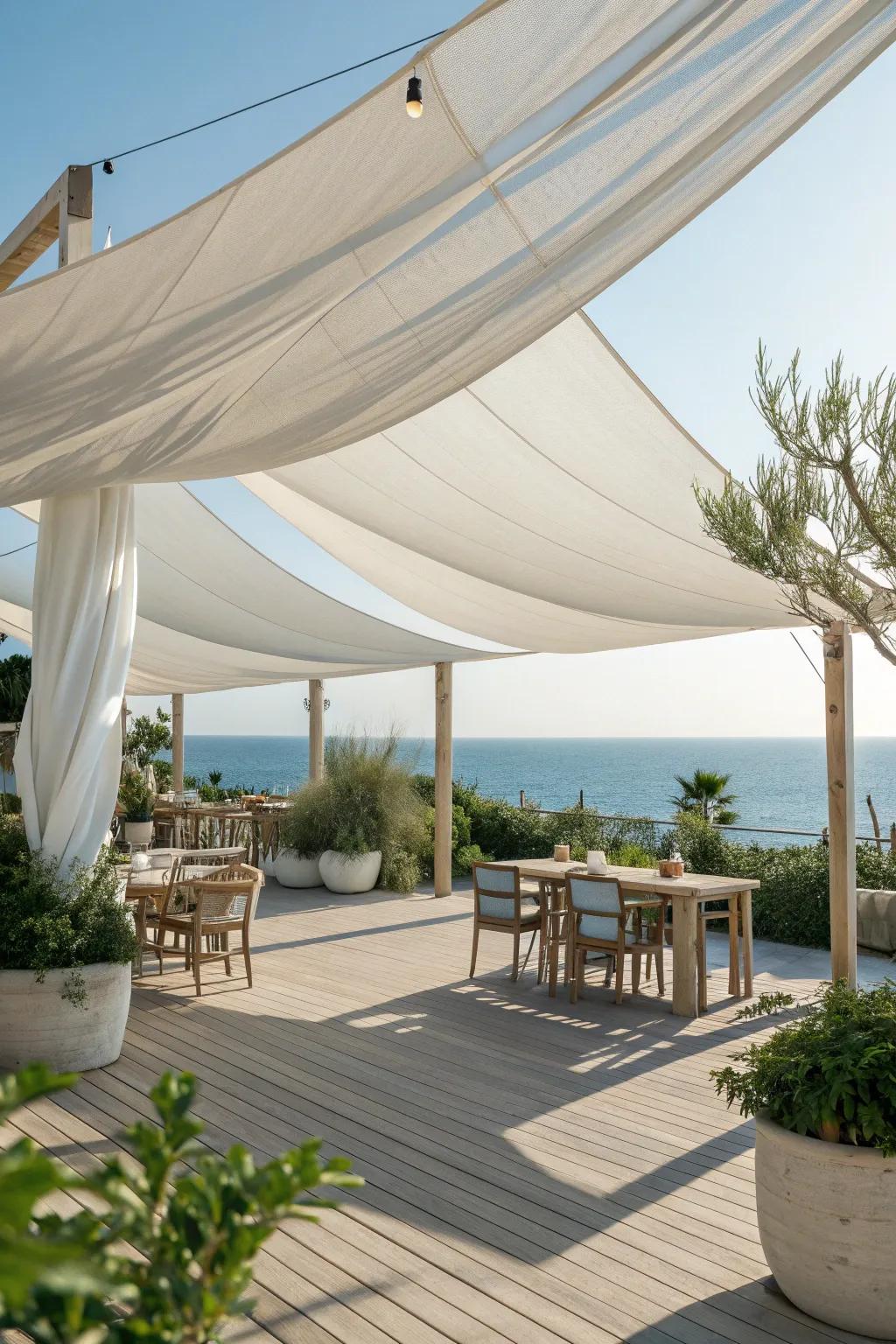 Sailcloth canopies add nautical charm and protect you from the sun. ⛵ #OutdoorShade #NauticalStyle