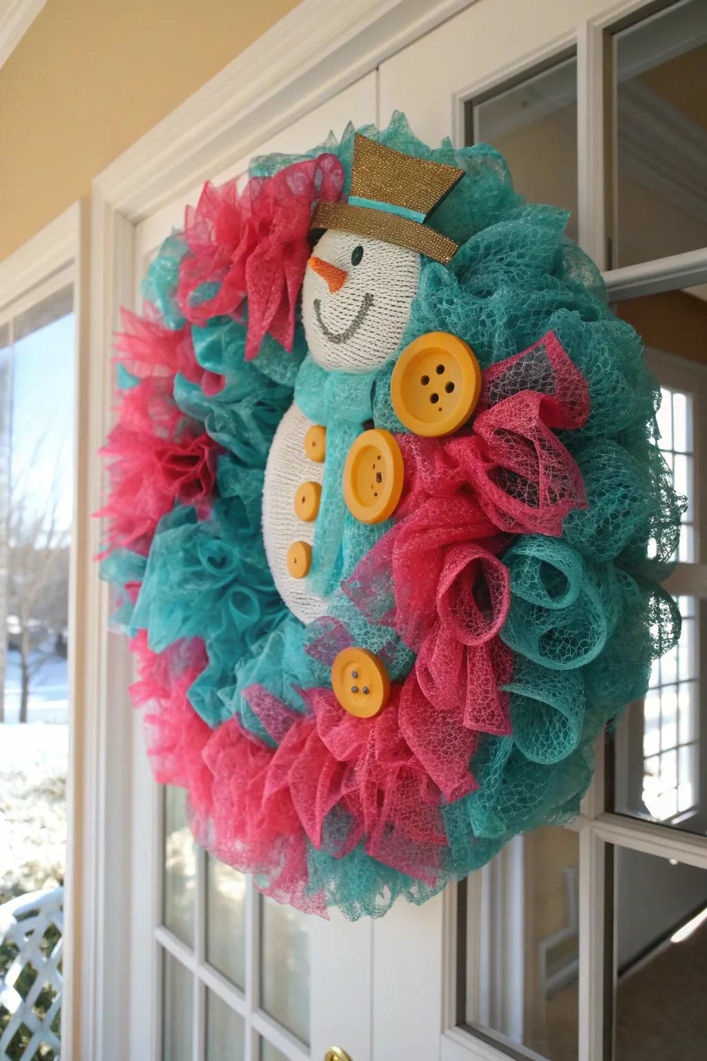 Brighten your decor with a deco mesh snowman wreath that's bursting with personality. #ColorfulDecor #DIYFun