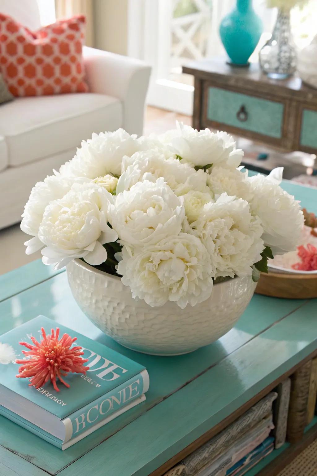 Sophisticated simplicity: White peonies in a ceramic bowl make an elegant statement.