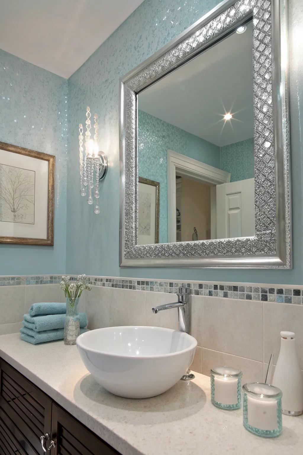 Achieve a sleek and refreshing look with ice blue and silver accents. #BathroomInspiration