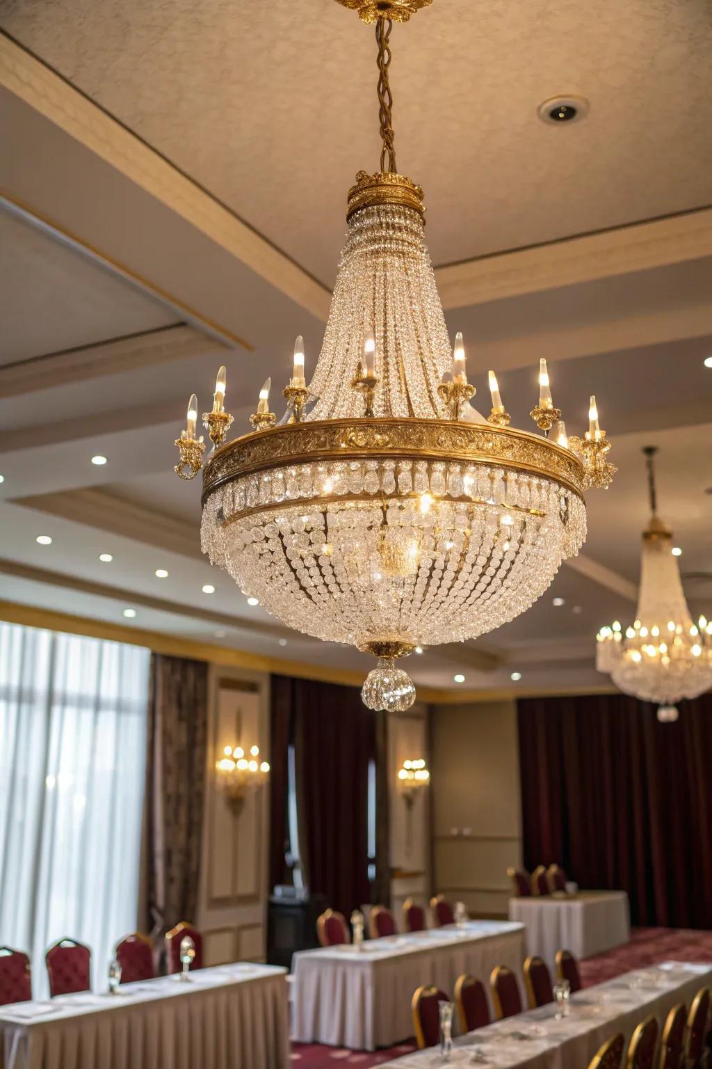 Make a bold statement with a glamorous chandelier that transforms your conference room into a luxurious space. #ChandelierLove #InteriorDesign